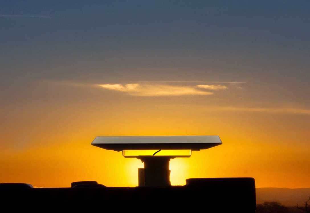 Starlink - Satellite - Sunset Photo of a Starlink satellite with a sunset behind it