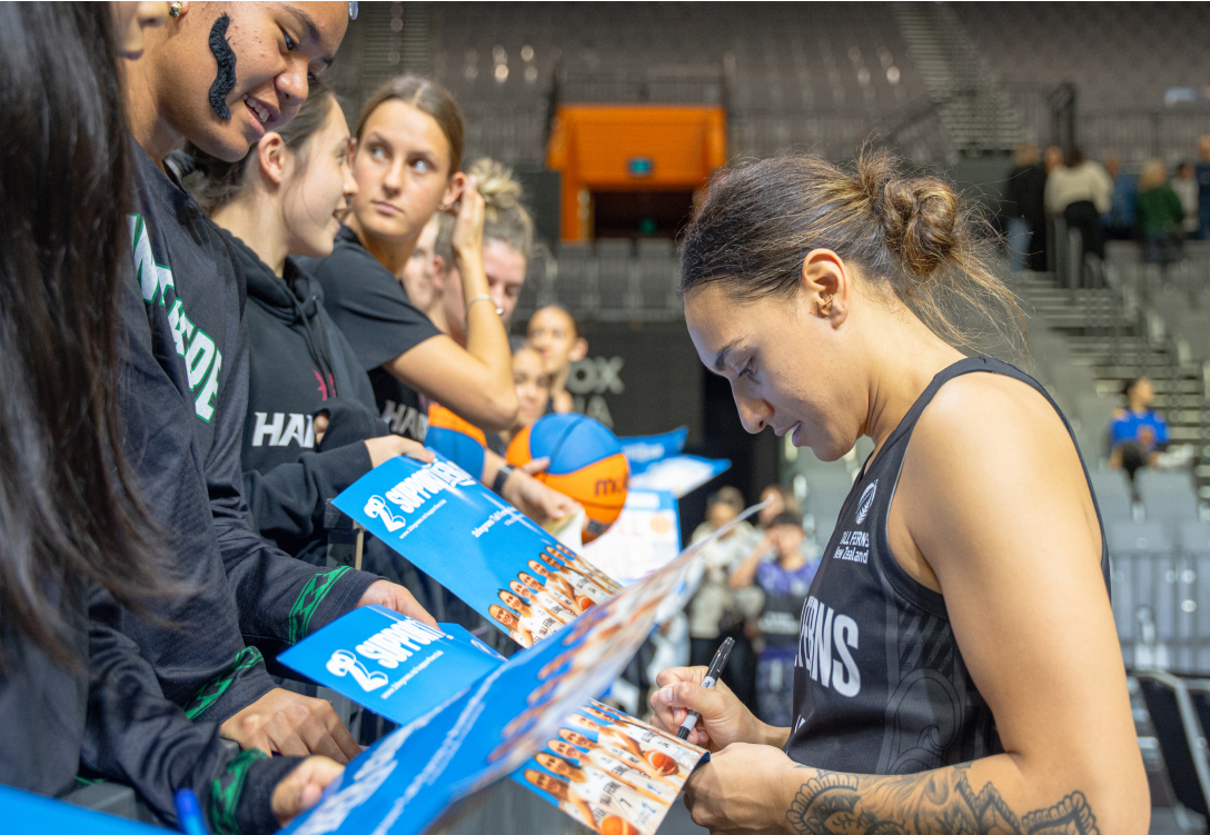 Member of the 2degrees Tall Ferns signing autographs