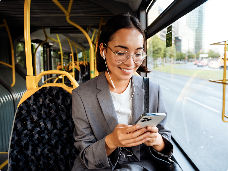Data Clock - Grab data on the go Lady sitting on a bus using her mobile phone